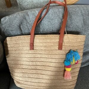 Chic Tan Tote Bag with Brown Handles and Colorful Tassels